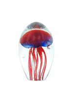 Pisapapeles de cristal con medusa roja y azul.