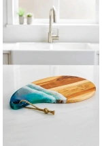Small oval cutting board with epoxy resin waves